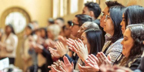 group of people clapping