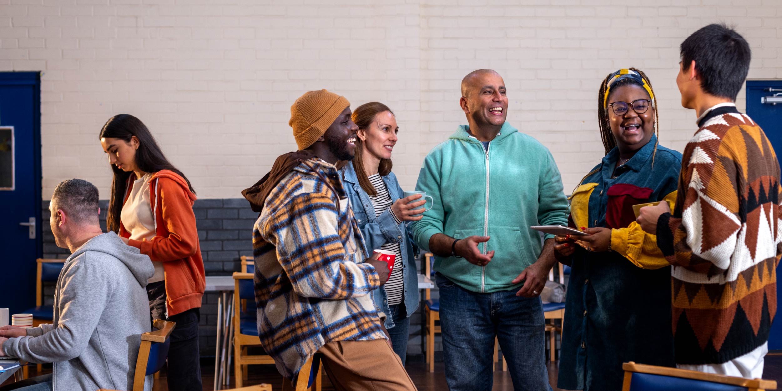 A group of community members talking and working together
