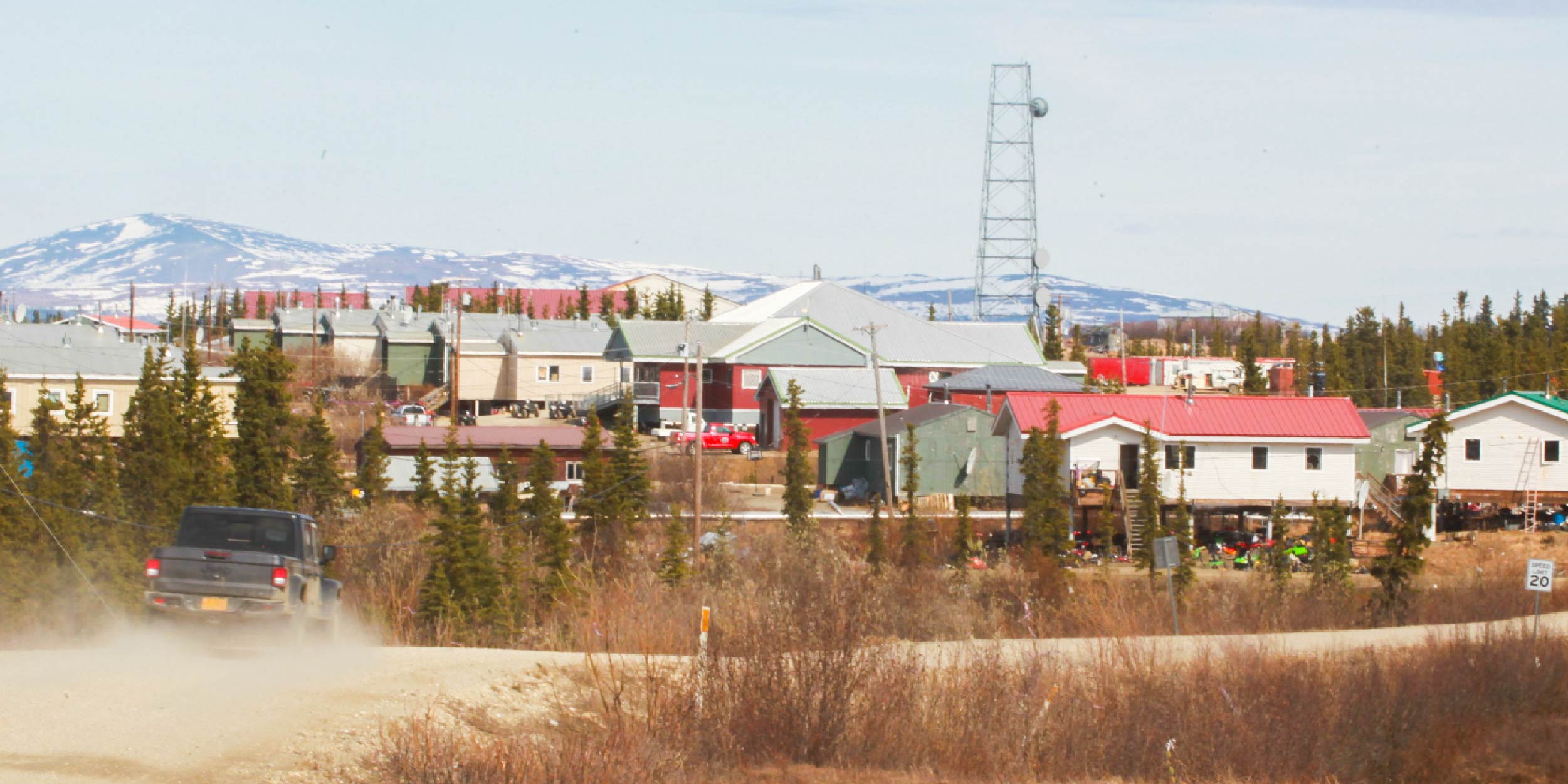 A car driving down a road in western Alaska