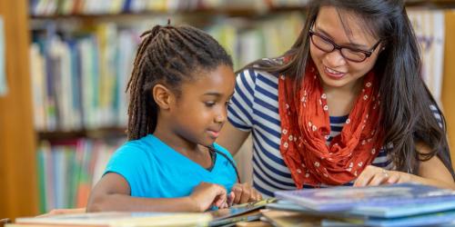 student reading in the classroom
