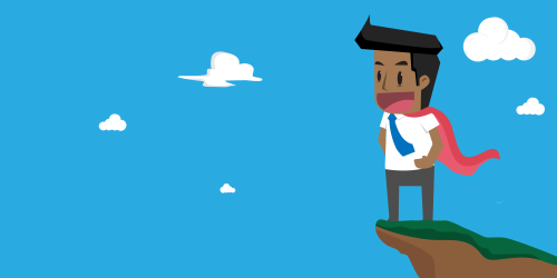 Person standing on a cliff looking into the distance