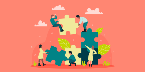 A group of people working together and building up a puzzle